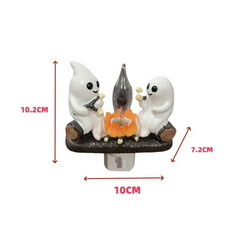 Halloween-themed night light with ghost figures and a candle, showing measurements on a white background.