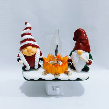 Two gnomes by a campfire night light on a white background